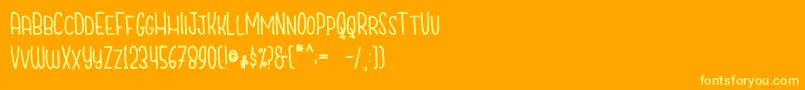 CutiescapsFree-fontti – keltaiset fontit oranssilla taustalla