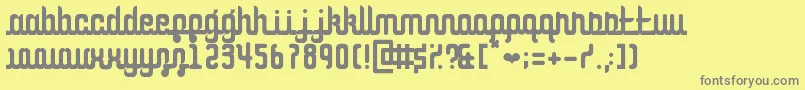 CurvaceousScript-Schriftart – Graue Schriften auf gelbem Hintergrund