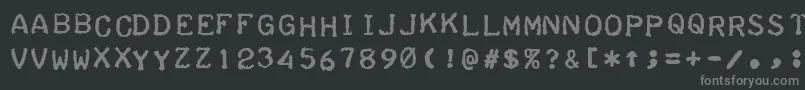 Fonte TeleprinterBoldItalic – fontes cinzas em um fundo preto