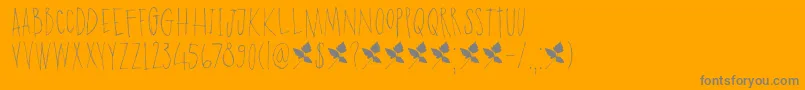 DkPoisonIvy-fontti – harmaat kirjasimet oranssilla taustalla