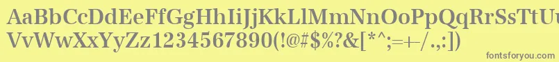 Urwantiquatmedextnar-fontti – harmaat kirjasimet keltaisella taustalla