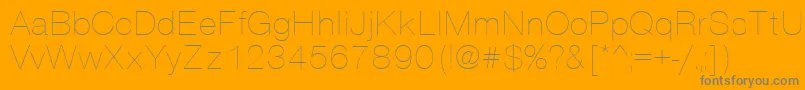 Vantathin-Schriftart – Graue Schriften auf orangefarbenem Hintergrund