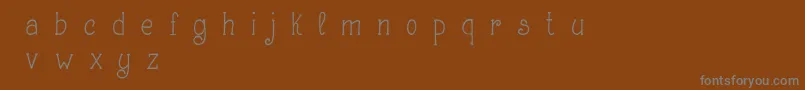 フォントMakingLetteringDemo – 茶色の背景に灰色の文字