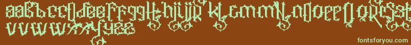 フォントOrnatix – 緑色の文字が茶色の背景にあります。