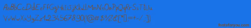 フォントPigeonScribble – 茶色の文字が青い背景にあります。