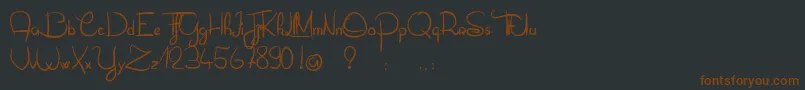 OliverTueLesFourmis-fontti – ruskeat fontit mustalla taustalla