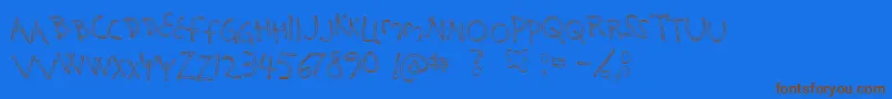 HolySmokes-Schriftart – Braune Schriften auf blauem Hintergrund