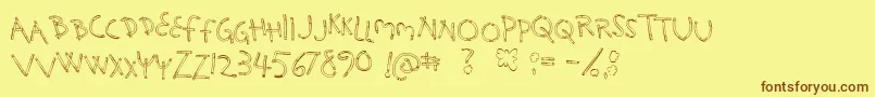 フォントHolySmokes – 茶色の文字が黄色の背景にあります。
