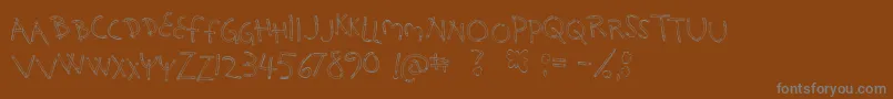 フォントHolySmokes – 茶色の背景に灰色の文字