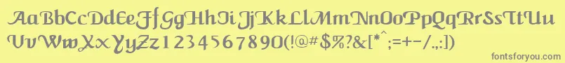 NewCalligraph-fontti – harmaat kirjasimet keltaisella taustalla