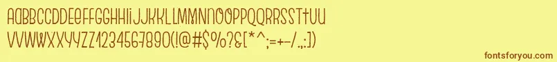 フォントEscalopeCrustTwo – 茶色の文字が黄色の背景にあります。