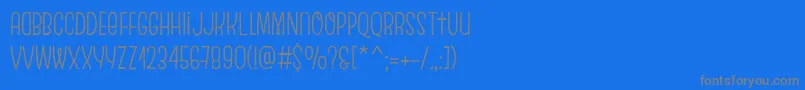 EscalopeCrustTwo-Schriftart – Graue Schriften auf blauem Hintergrund