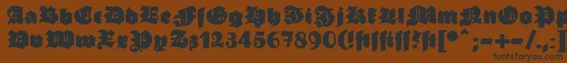 フォントGanzgrobegotisch – 黒い文字が茶色の背景にあります