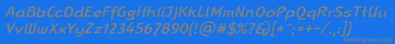 LinotypeRanaMediumItalic-fontti – harmaat kirjasimet sinisellä taustalla