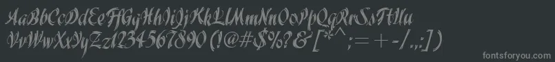 WisteriaItcTt-fontti – harmaat kirjasimet mustalla taustalla