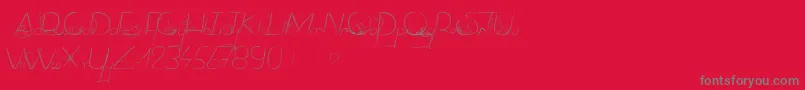 DancingOnTheGrass Font – Gray Fonts on Red Background