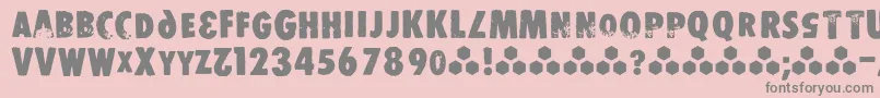 フォントStomper – ピンクの背景に灰色の文字