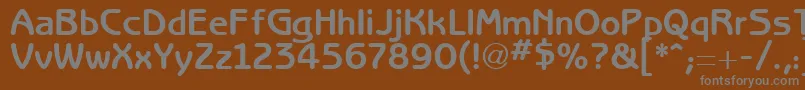 RedjaminGothic-fontti – harmaat kirjasimet ruskealla taustalla