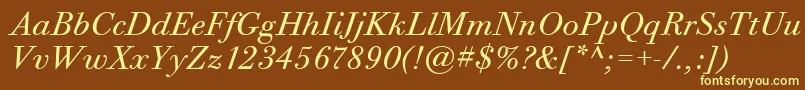 BodoniTwelveItcBookItalic-fontti – keltaiset fontit ruskealla taustalla