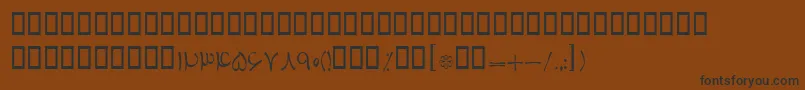 フォントBTabassom – 黒い文字が茶色の背景にあります
