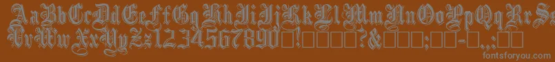 Fonte Embossedblack – fontes cinzas em um fundo marrom
