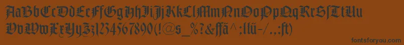NotreDameLtRomanDfr-Schriftart – Schwarze Schriften auf braunem Hintergrund