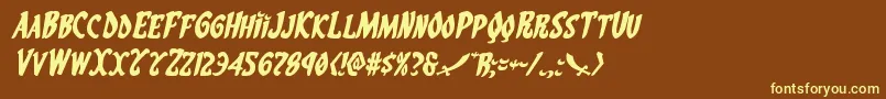 Eskindarexpandital-fontti – keltaiset fontit ruskealla taustalla