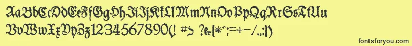 フォントSchneiderBuchDeutschTrashFree – 黒い文字の黄色い背景