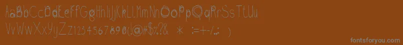 En savoir plus sur la police Fil01 Police Fil01 – polices grises sur fond brun