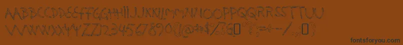 HolysmokesRegular-Schriftart – Schwarze Schriften auf braunem Hintergrund