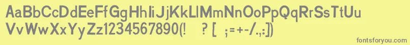 フォントCreatininPro – 黄色の背景に灰色の文字