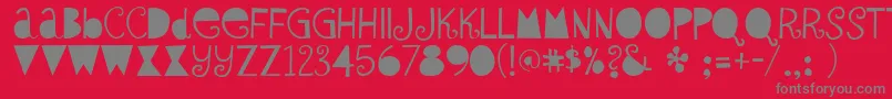 SybilGreen-Schriftart – Graue Schriften auf rotem Hintergrund