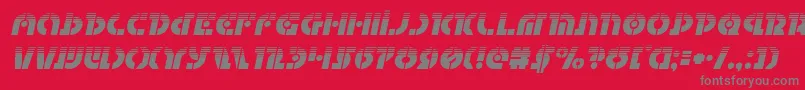 Questlokhalfital-Schriftart – Graue Schriften auf rotem Hintergrund