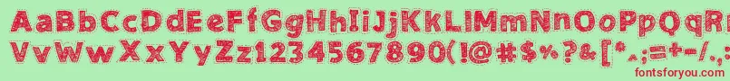 NeedleworkGood Font – Red Fonts on Green Background