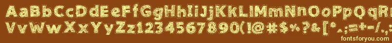 NeedleworkGood-fontti – keltaiset fontit ruskealla taustalla