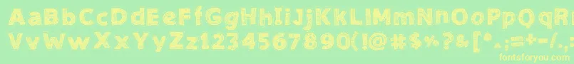 フォントNeedleworkGood – 黄色の文字が緑の背景にあります