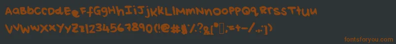 Czcionka ReisHandwritingThick – brązowe czcionki na czarnym tle