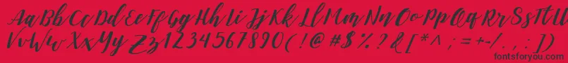 DanieshaForPersonalUse Font – Black Fonts on Red Background