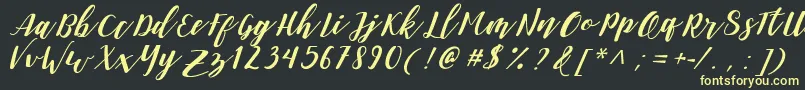 DanieshaForPersonalUse Font – Yellow Fonts on Black Background