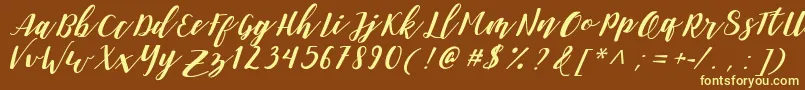 DanieshaForPersonalUse-fontti – keltaiset fontit ruskealla taustalla