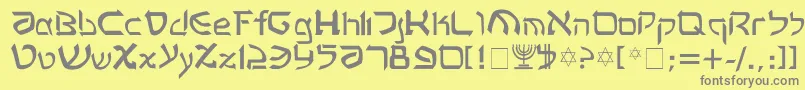 フォントRashela – 黄色の背景に灰色の文字