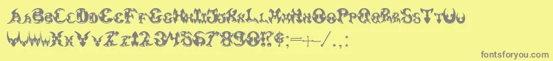 フォントPauls3DTribal – 黄色の背景に灰色の文字