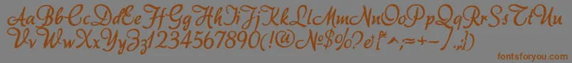 フォントAkadora – 茶色の文字が灰色の背景にあります。