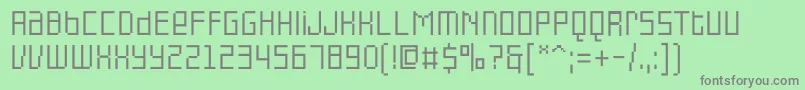 PfonlinethreeproSingleuni-fontti – harmaat kirjasimet vihreällä taustalla