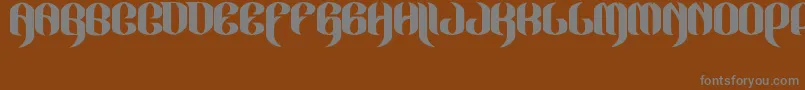 JakejarkorLocura-Schriftart – Graue Schriften auf braunem Hintergrund