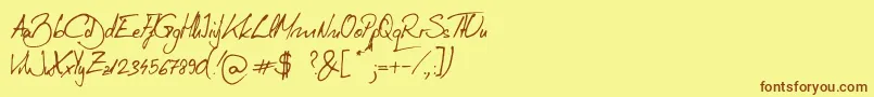 フォントTudy1311 – 茶色の文字が黄色の背景にあります。