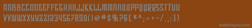 SfShaiFontaiBold-fontti – harmaat kirjasimet ruskealla taustalla