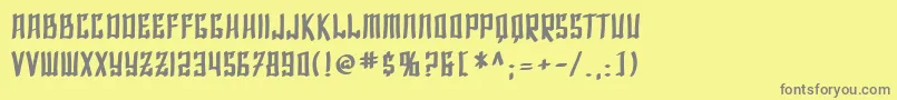 SfShaiFontaiBold-fontti – harmaat kirjasimet keltaisella taustalla