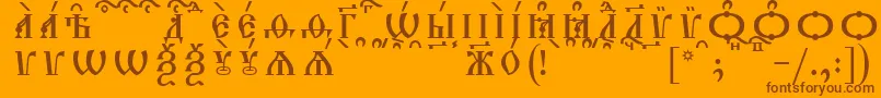 TriodionCapsKucsSpacedout-Schriftart – Braune Schriften auf orangefarbenem Hintergrund