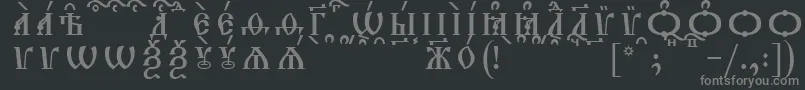 Шрифт TriodionCapsKucsSpacedout – серые шрифты на чёрном фоне